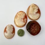 Vintage collection of carved cameos and seal . This lot includes three carved shell cameos, a lava