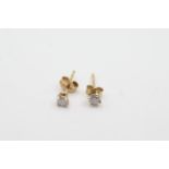 9ct gold diamond stud earrings weighs 0.6 grams. Marked 9k . Measures approx 3mm wide.