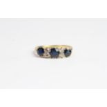 Antique 18 CT gold sapphire and diamond ring. Set with alternating sapphires and old cut diamonds.