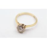 9ct gold clear gemstone solitaire ring - weighs 2.4 grams. Marked 375 with a Tudor rose and the