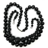 Antique Victorian large carved Whitby jet necklaces . Pair of faceted and carved Whitby jet