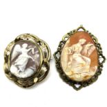Antique pair of carved mythological cameo brooches . One of the brooches is set in a swivel frame.