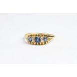 Antique 18 CT gold cornflower blue sapphire and old cut diamond ring. Set with three cornflower blue