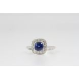 18CT WHITE GOLD SAPPHIRE AND DIAMOND CLUSTER RING, sapphire weight 1.16ct. UK size M. Total weight