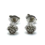 Fine 9ct white gold diamond stud earrings. Measure 5mm wide . Marked 9k . Total weight 0.9 grams .