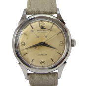 BAUME SWISS POWER RESERVE AUTOMATIC WRISTWATCH WITH ARABIC NUMERALS CIRCA 1950s. AUTOMATIC CAL,