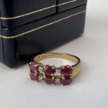 Fine 9CT gold ruby and diamond ring. Fully hallmarked for 9CT gold. Set with alternating rubies