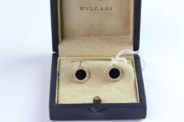 Bulgari 18ct gold, diamond 0.66ct and onyx cufflinks, comes with Bulgari box. The front of the