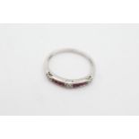 9ct white gold ruby & diamond band ring weighs 1.3 grams. Channel set with rubies and diamonds in