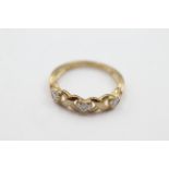 9ct gold diamond heart twist band ring - weighs 2 grams . Set with diamonds in each of the hearts.