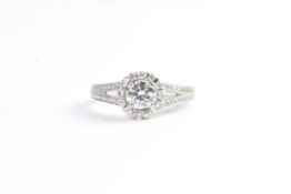 Fine 18 CT white gold 35 point diamond halo ring. Marked 18 K750 & D0.35. UK size L. Total weight 4.