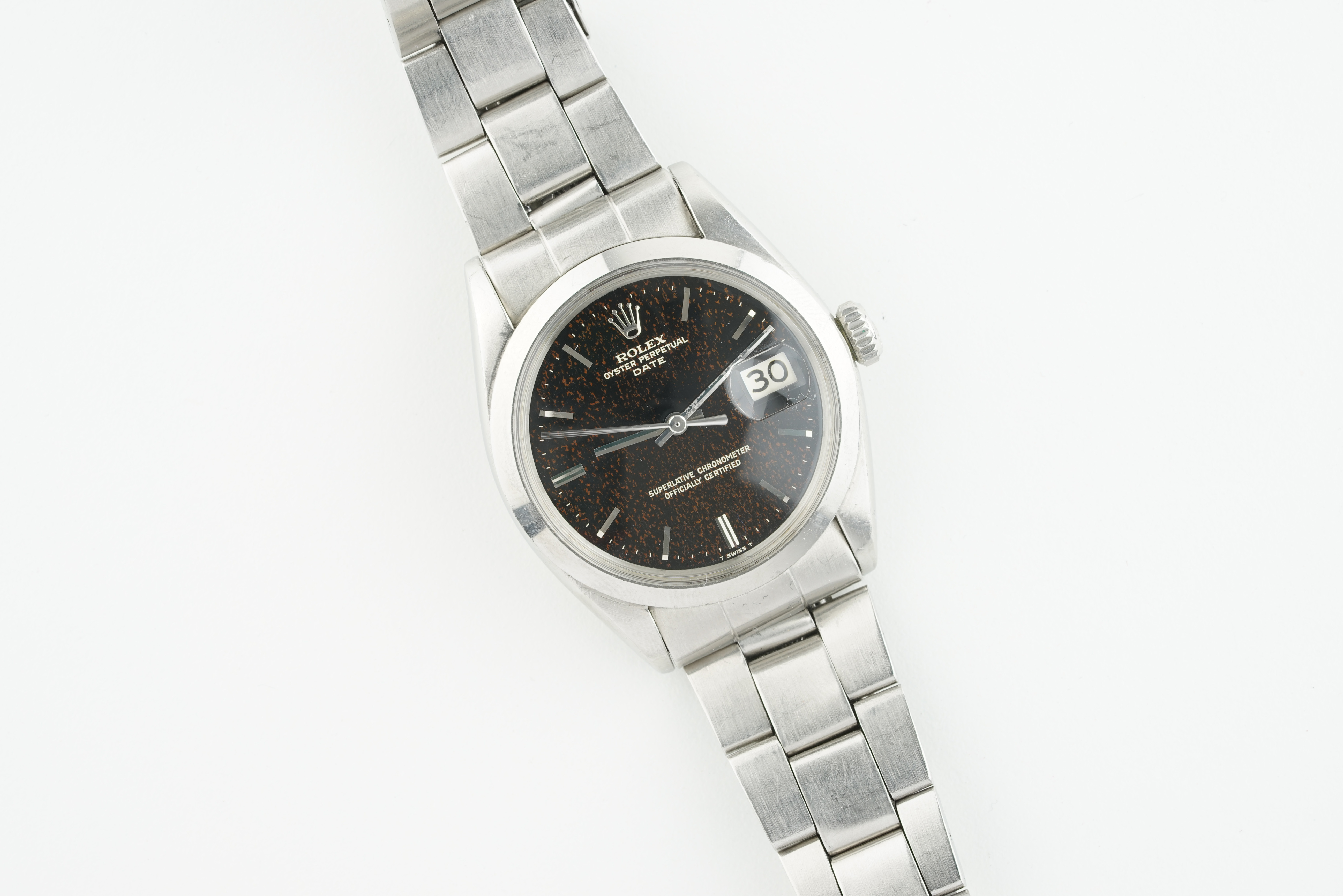 RARE ROLEX OYSTER PERPETUAL DATE GILT 'RED FLAKE' DIAL REF. 1500 CIRCA 1967, circular gloss black