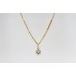 In yellow gold a flat curb and rod chain, 16 inches (40cm) with a fixed solitaire diamond pendant.