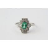 An oval emerald is set to the centre of this diamond tablet ring. Diamonds 0.60, Emerald 0.77,