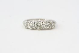 A graduated 5 stone diamond ring the total diamond weight 1.50 carats. Stamped PLAT