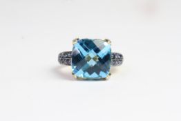 Heavy 14 carat gold topaz and sapphire ring. Set with a large topaz faceted stone in the centre