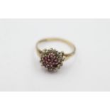 9ct gold ruby & diamond floral halo ring weighs 1.8 grams. Set with rubies in the center and