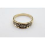 9ct gold 25 point diamond band ring weighs 3.1 grams . Fully hallmarked for 9ct gold . Set with 25