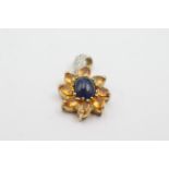 9ct gold diamond & sapphire floral pendant weighs 2.8 grams . Measures 2.3cm x 1.5cm wide. Set