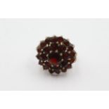 9ct gold garnet double halo set ring weighs 5.3 grams. The head of the ring measures 2cm wide . Uk