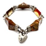 Antique silver scottish agate bracelet with a padlock clasp. Measures 19cm in length by 2cm wide.