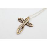 9ct gold diamond set cross pendant necklace weighs 2.1 grams. Channel set with brilliant cut