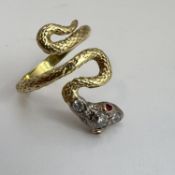 Fine high carat gold and old cut diamond snake ring. Set with ruby eyes and old cut diamonds