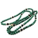 Fine 14ct gold malachite bead necklace . Measures 82cm in length . Marked 14k . The beads measure