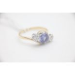 Fine 18ct Gold Tanzanite and Diamond Twist Three Stone Ring Set with two Diamonds in a illusion