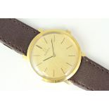 MANUAL WIND OMEGA, Champagne dial, in a 33mm gold plated case. On a leather strap with buckle.