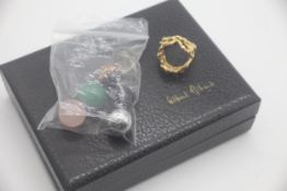 Gilbert and Albert designer 18ct gold interchangeable ring in original box. Comes with a selection