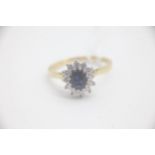 Fine 18ct Gold Sapphire and Diamond Cluster Ring Set with a large oval Sapphire measuring an