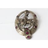 Antique silver plated Austro Hungarian knight brooch. Set in silver plate with red paste stones ,