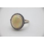14ct Gold Etheopian Opal and Diamond Set Ring Beautifully set with a large Etheopian Opal surrounded