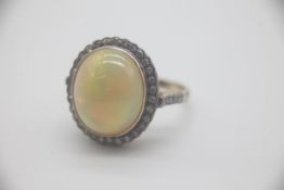 14ct Gold Etheopian Opal and Diamond Set Ring Beautifully set with a large Etheopian Opal surrounded