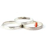 Vintage sterling silver and coral bangles and ring quanity of . No dents to the bangles . The head