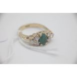 Fine 18ct Gold Emerald and Diamond Ring Set with an Oval Emerald in the centre surrounded by