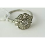 Fine platinum and diamond ring. Set in solid platinum marked PLAT. The head of the ring measures