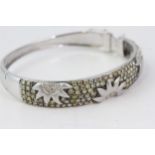 Fine 18 CT white gold fancy champagne yellow diamond bangle. Marked 750/18 K. Set with brilliant cut
