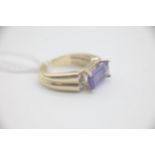 Fine 14ct gold tanzanite and diamond ring. Set in 14ct gold marked 14k. Weighs 4.3 grams. Uk size M