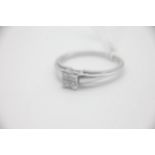 Fine 18ct White Gold 25pt Diamond RingSet with four Princess Cut Diamonds totalling 25pts. UK Size