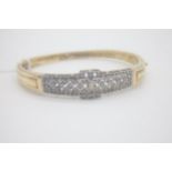 Fine 18ct Gold and Diamond Bangle The main body of the bangle is set in solid Yellow 18ct Gold and