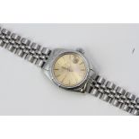 LADIES ROLEX OYSTER PERPETUAL DATE REFERENCE 6919 CIRCA 1980, circular champagne dial with baton