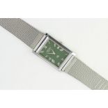 SEIKO QUARTZ WRISTWATCH, rectangular deep green dial with roman numeral hour markers, 26mm x 32mm