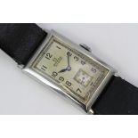 OMEGA ART DECO T17 MANUAL WIND WRISTWATCH, rectangular patina dial with arabic numeral hour markers,