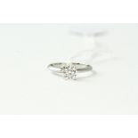 18kt White gold solitaire diamond ring, approximately 0.72cts H/VS2 , weighs 2.5 grams . Uk size M .