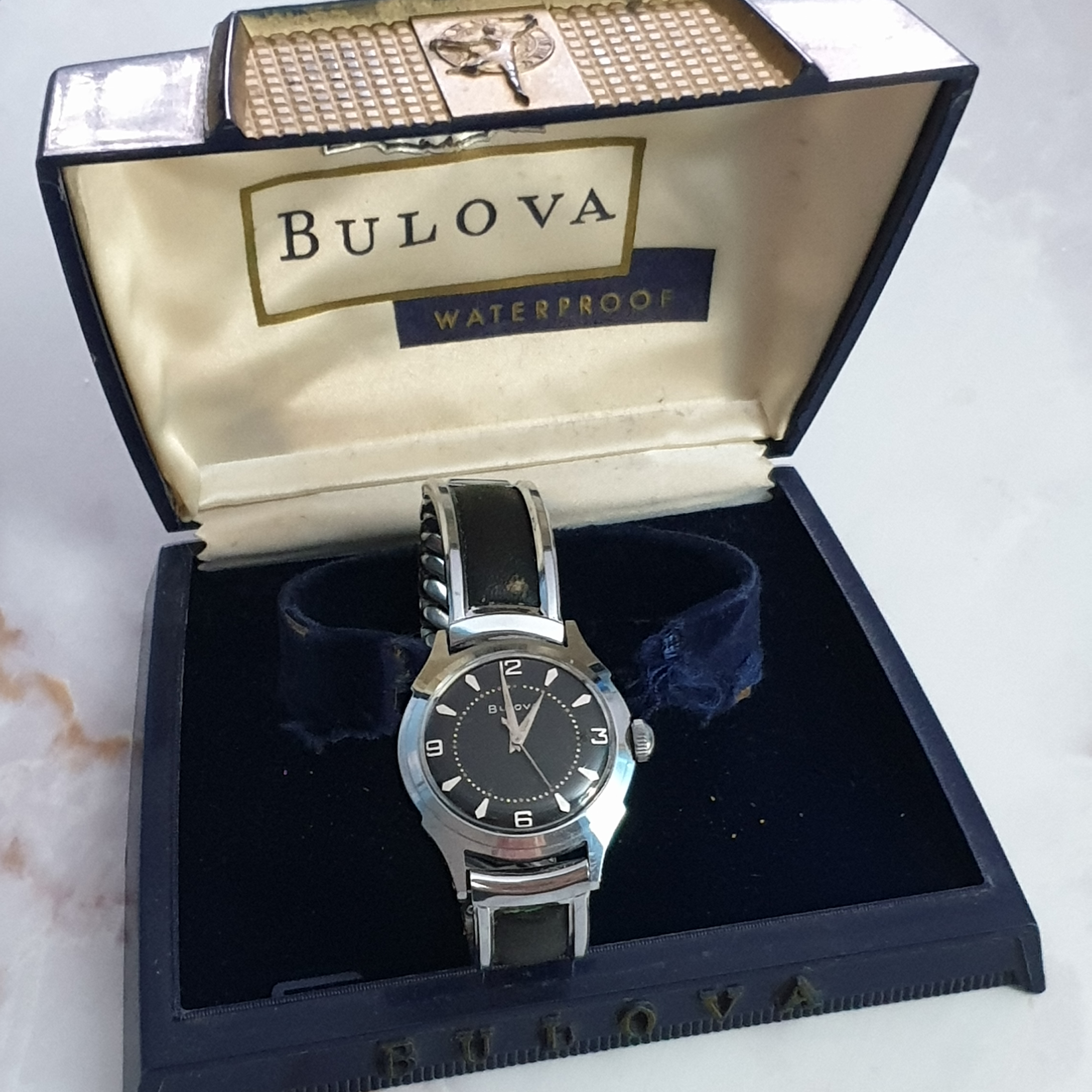 BULOVA MANUAL WIND WRISTWATCH WITH BLACK WAFFLE/HONEYCOMB DIAL IN CHROME PLATE CASE WITH ORIGINAL - Image 10 of 12