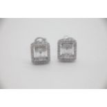 Fine 18ct White Gold and Diamond Halo Stud Earrings Set with approx. 0.64carats of Diamonds. The