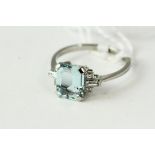 Fine platinum diamond and aquamarine ring, set in platinum with diamonds either side of an