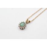 9ct gold diamond framed emerald pendant on chain (1.9g)